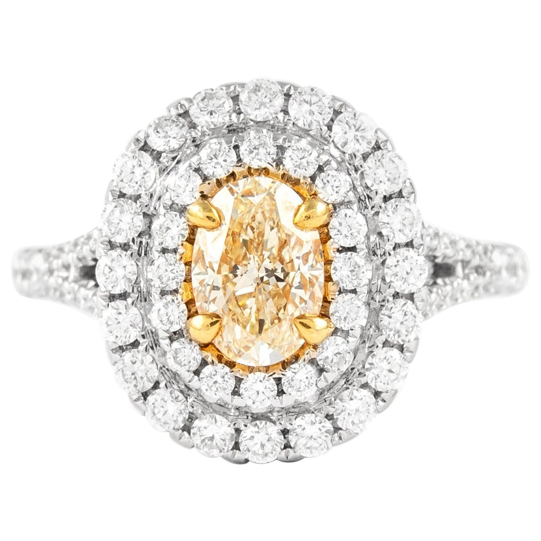 1.83ct Fancy Yellow VS2 Diamond Double Halo Ring 18k Gold: 1.83ct Fancy Yellow VS2 Diamond Double Halo Ring 18k Gold This exquisite 1.83 carat total weight Fancy Yellow VS2 Diamond Double Halo Ring showcases a stunning oval cut Fancy Yellow diamond at its cen