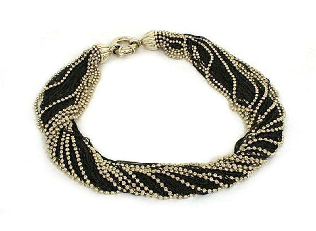 Tiffany & Co. Sterling Silver Twisted Chain Necklace Vintage: Tiffany & Co. Sterling Silver Twisted Chain Necklace Vintage This authentic Tiffany & Co. twisted multi-chain necklace is crafted from polished sterling silver, featuring a bold and sculptural design.