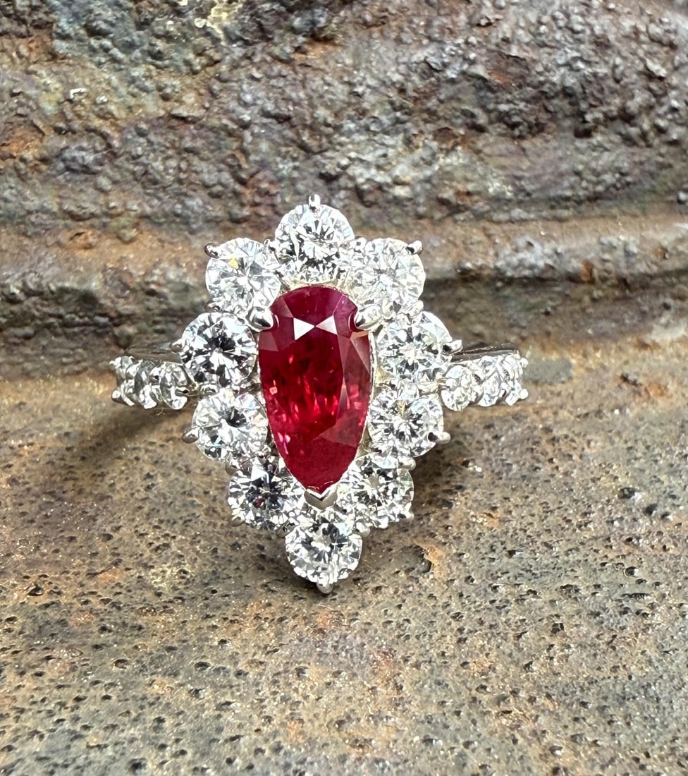 GIA Burma Ruby Diamond Platinum Cocktail Ring Size 6: GIA Burma Ruby Diamond Platinum Cocktail Ring Size 6 This platinum cocktail ring features a vivid Pigeon's Blood red Burma ruby, certified by GIA, as its centerpiece. The natural pear-shaped ruby weig