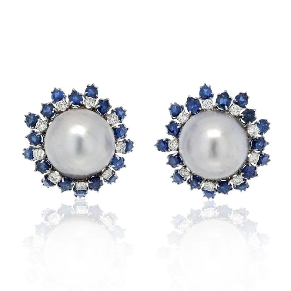 David Webb Platinum 18K White Gold Mobe Pearl Sapphire Diamond Earrings: David Webb Platinum 18K White Gold Mobe Pearl Sapphire Diamond Earrings Discover the exquisite allure of these David Webb earrings, crafted in a stunning combination of platinum and 18K white gold. Ea