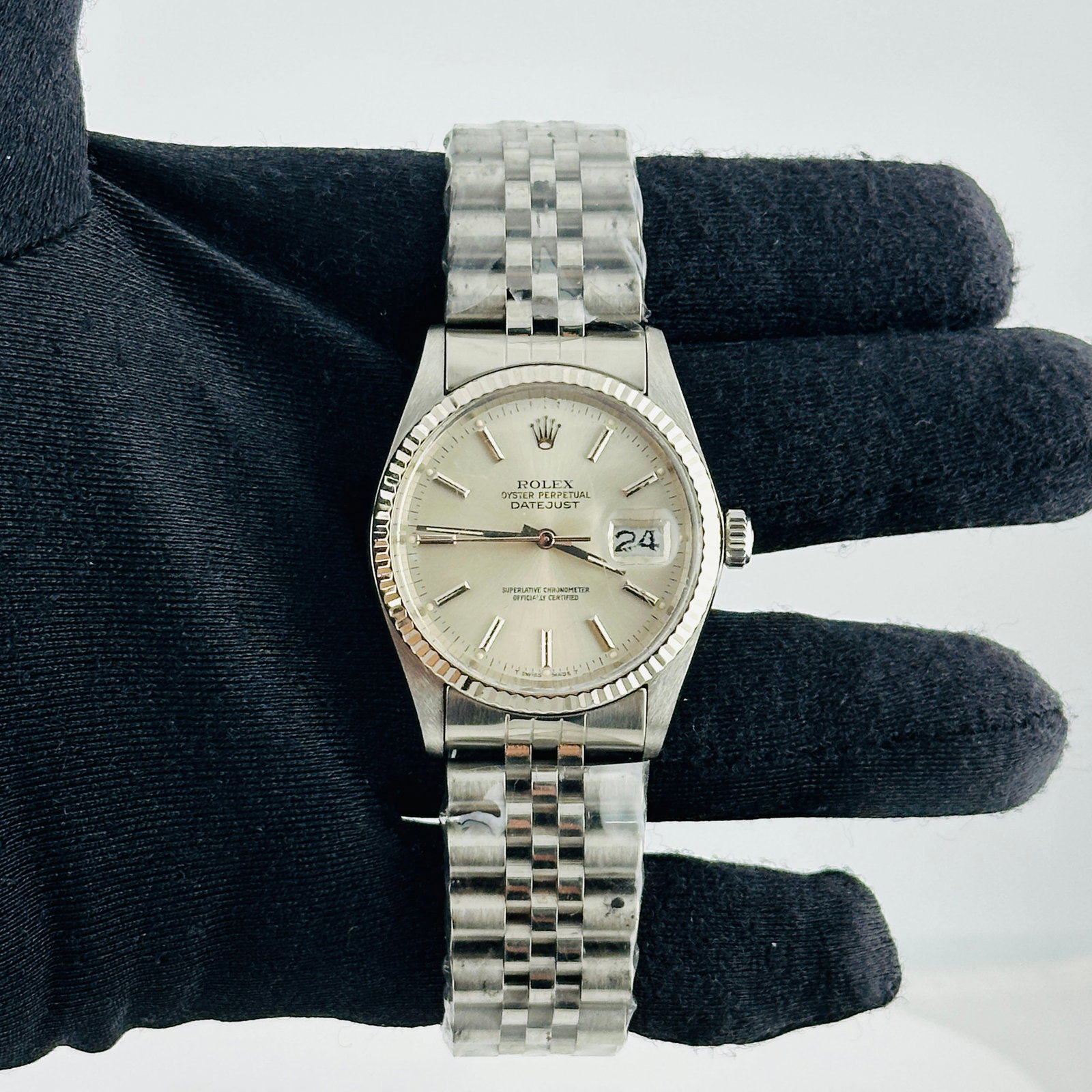 Rolex Datejust 16014 Silver Stick Dial Jubilee Bracelet: Rolex Datejust 16014 Silver Stick Dial Jubilee Bracelet This Rolex Datejust features a silver stick dial, fluted bezel, and is fitted with an aftermarket Jubilee bracelet. The watch is identified by r