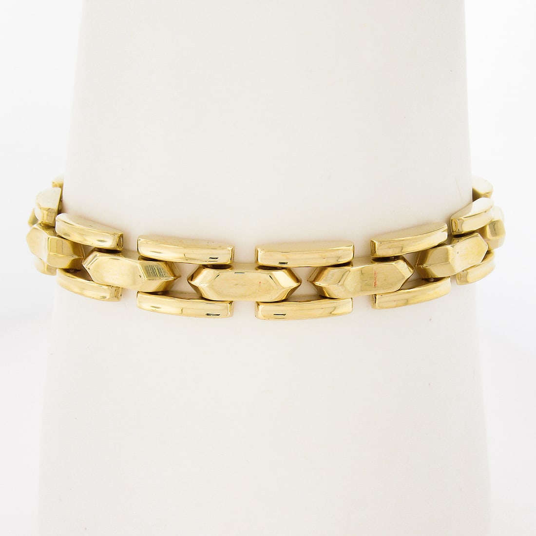 Vintage Retro 14K Yellow Gold 7 Inch Geometric Open Strap Link Bracelet: Vintage Retro 14K Yellow Gold 7 Inch Geometric Open Strap Link Bracelet This exquisite Vintage Retro bracelet features a stunning 14K yellow gold construction with a polished finish. Measuring 7 inche