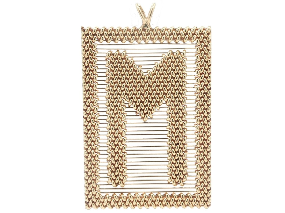 Large Vintage 13-14k Yellow Gold M Initial Pendant Wire and Weave Design: Large Vintage 13-14k Yellow Gold M Initial Pendant Wire and Weave Design This vintage pendant features a large initial "M" design crafted from solid 13-14k yellow gold with intricate wire and weave wo