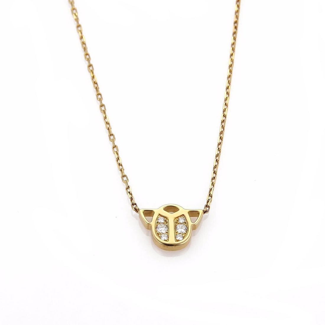 Cartier scarab diamond pendant necklace 18k yellow gold with paper: Cartier scarab diamond pendant necklace 18k yellow gold with paper This authentic Cartier necklace features a finely detailed scarab pendant crafted in solid 18k yellow gold and accented with natural