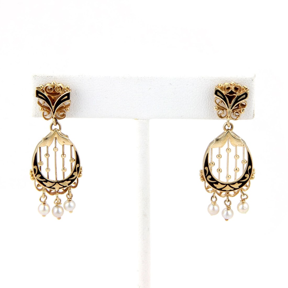 Vintage 14k Yellow Gold Pearl Enamel Drop Earrings: Vintage 14k Yellow Gold Pearl Enamel Drop Earrings These vintage dangle earrings are crafted from 14k yellow gold and feature luminous pearls accented with delicate enamel detailing. Designed in an el