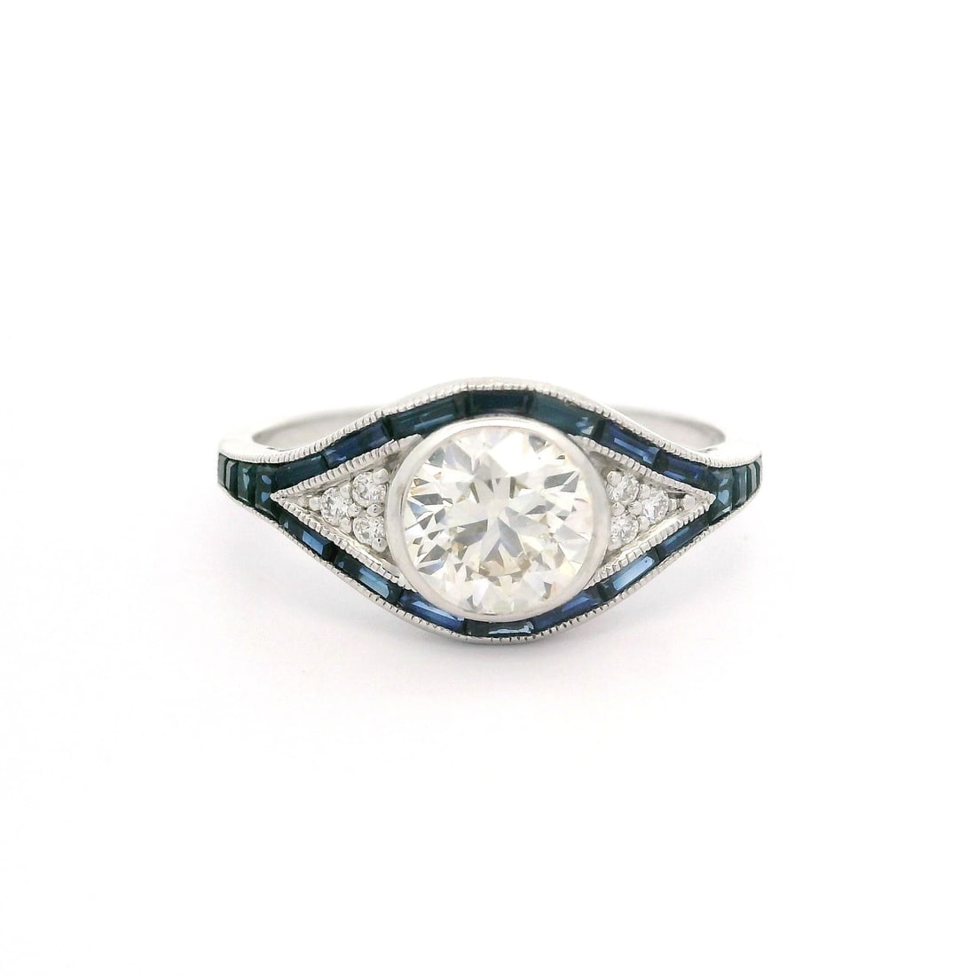 Art Deco 14k White Gold Diamond Sapphire Eye Ring IGI Certified 1.26ctw: Art Deco 14k White Gold Diamond Sapphire Eye Ring IGI Certified 1.26ctw This exquisite Art Deco style ring features a stunning combination of diamonds and sapphires set in solid 14k white gold. The ce
