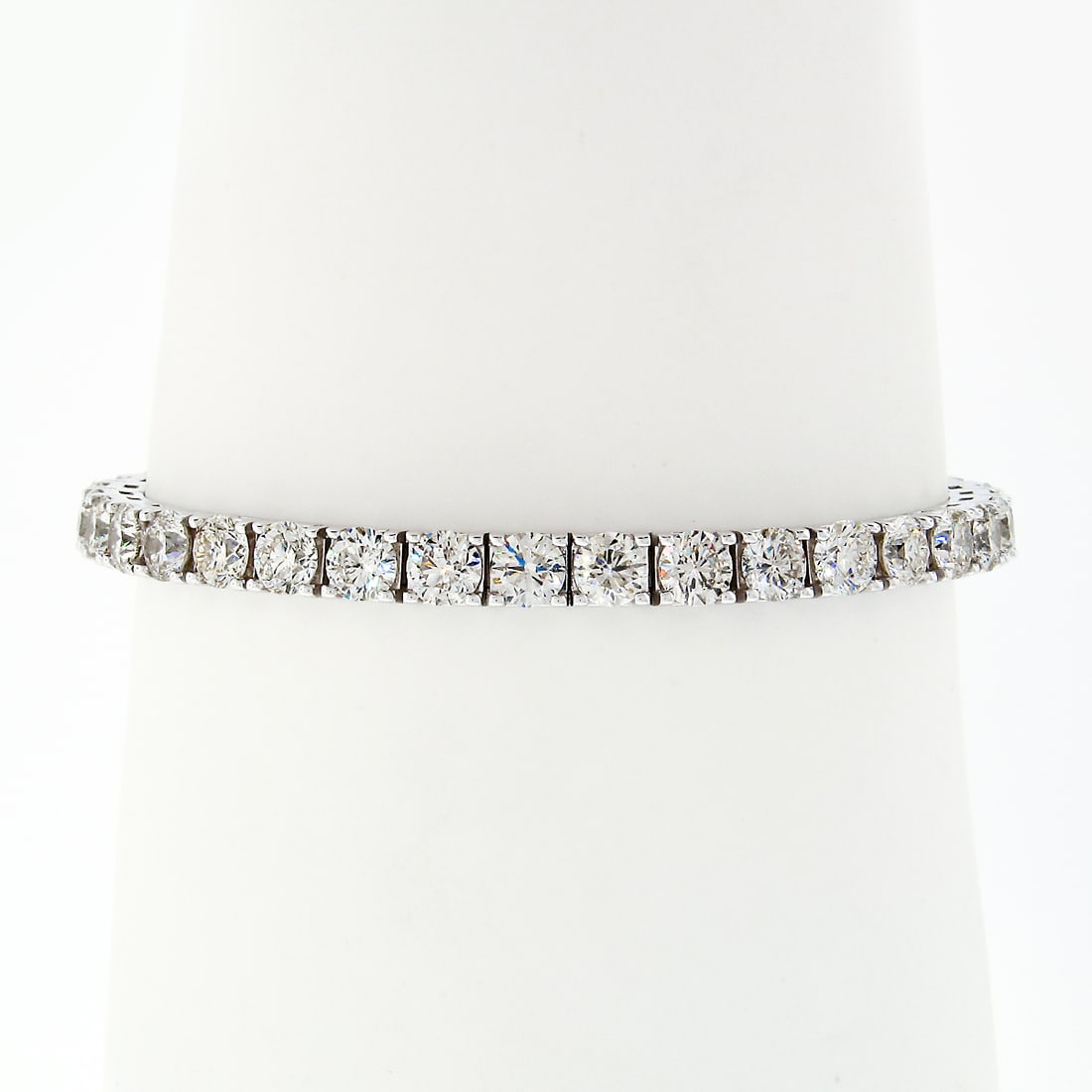 18k White Gold 12.21ctw Diamond Tennis Bracelet 37 Round Brilliant Diamonds: 18k White Gold 12.21ctw Diamond Tennis Bracelet 37 Round Brilliant Diamonds This stunning 18k white gold statement tennis bracelet features 37 large, fiery round brilliant diamonds, totaling approxima