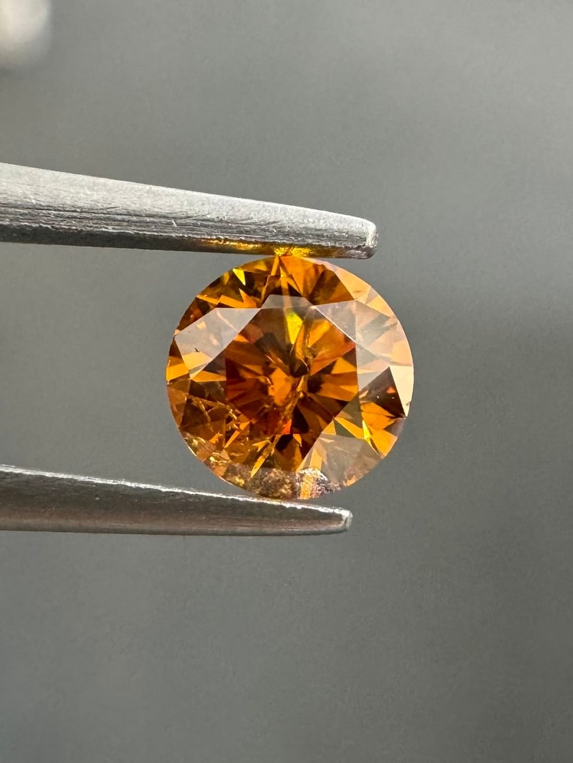 Loose Diamond - ROUND 0.4ct Fancy Deep Yellowish Orange I2: Loose Diamond - ROUND 0.4ct Fancy Deep Yellowish Orange I2 Source: Natural Shape: ROUND Carats: 0.4 Color: Fancy Deep Yellowish Orange Certification: GIA Video: