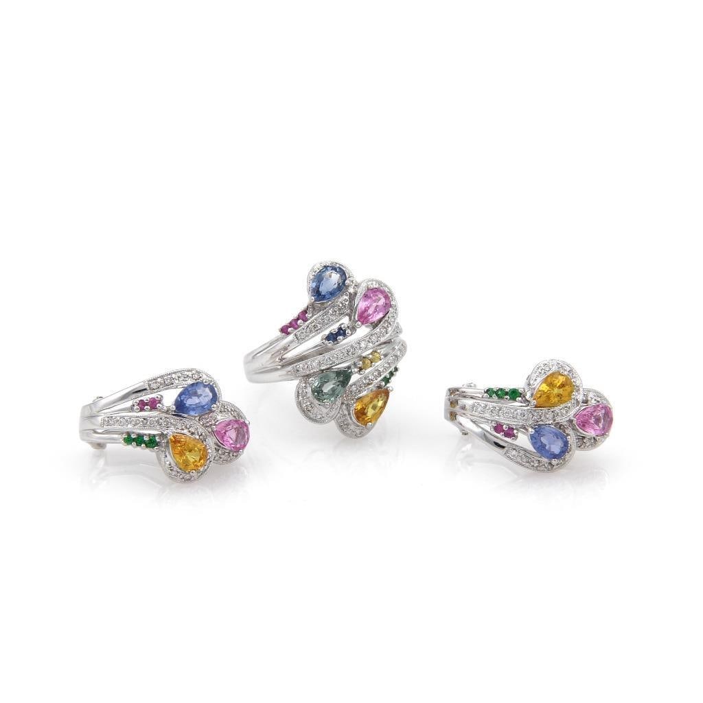14k White Gold Sapphire Diamond Earrings Ring Set: 14k White Gold Sapphire Diamond Earrings Ring Set This elegant set includes a pair of modern style earrings and a matching ring, both crafted from 14k white gold. The earrings feature a triple curved 