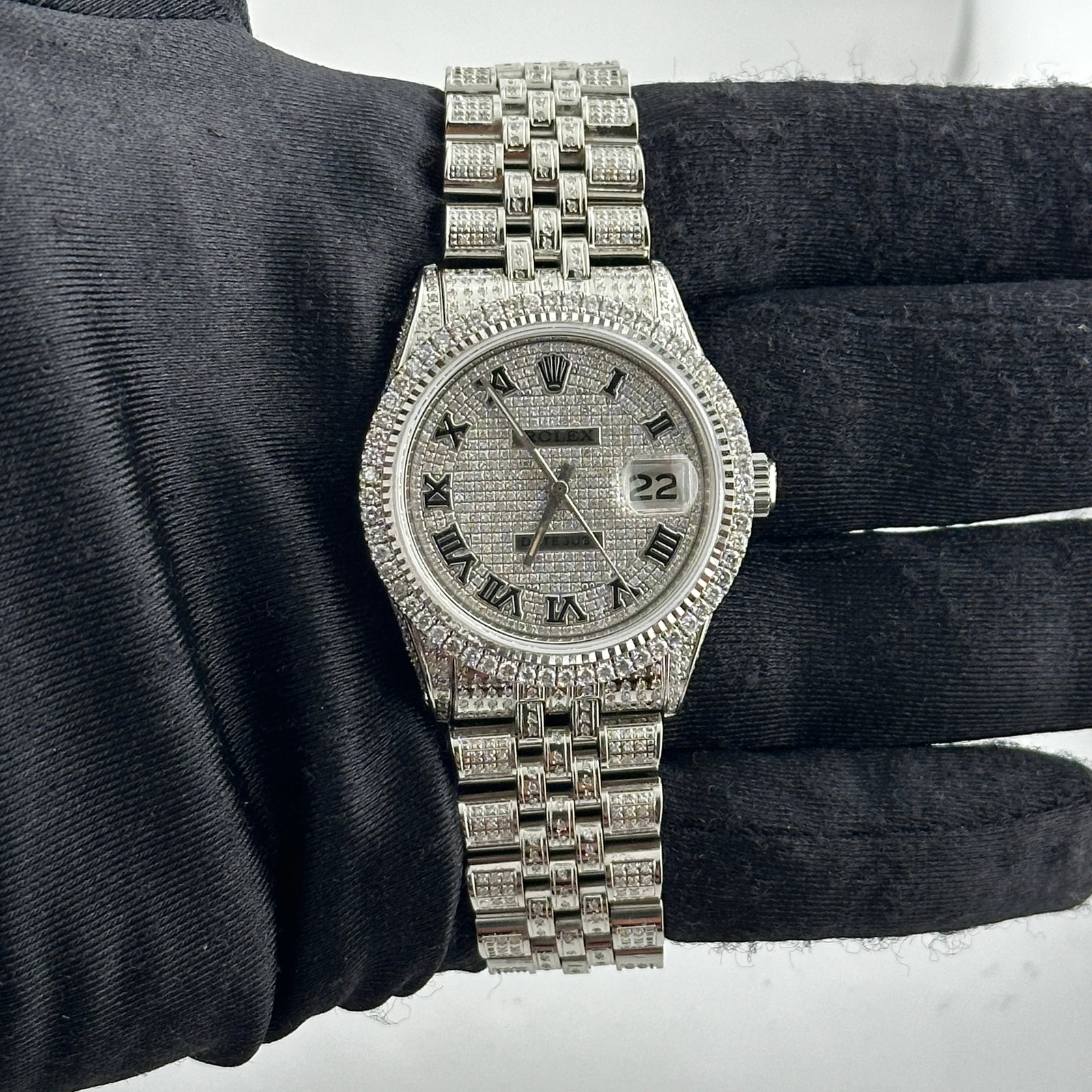 Rolex Datejust 1601 Aftermarket Diamond Roman Dial Jubilee Bracelet Watch: Rolex Datejust 1601 Aftermarket Diamond Roman Dial Jubilee Bracelet Watch This Rolex Datejust features an iced out Roman dial and a prong diamond bezel, offering a striking and luxurious look. The wat