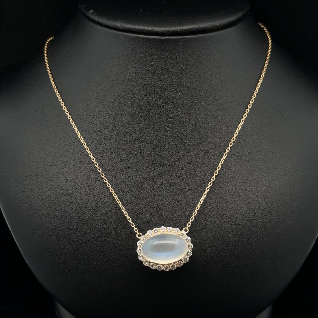 18k Yellow Gold Moonstone Diamond Halo Pendant Necklace Adjustable: 18k Yellow Gold Moonstone Diamond Halo Pendant Necklace Adjustable This exquisite adjustable necklace features a stunning pendant crafted from solid 18k yellow gold, showcasing a natural blue moonston