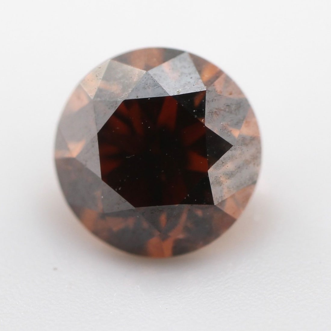 Loose Diamond - ROUND 0.72ct Fancy Dark Orangey Brown VS2: Loose Diamond - ROUND 0.72ct Fancy Dark Orangey Brown VS2 Source: Natural Shape: ROUND Carats: 0.72 Color: Fancy Dark Orangey Brown Certification: NONE PLEASE NOTE: Framed, Large, or heavy items do no