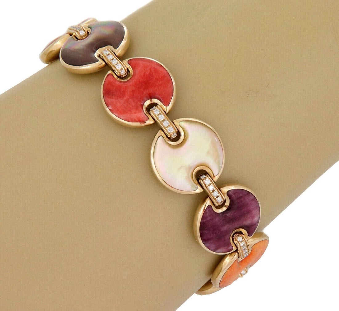 Kabana 14k Gold Gemstone Button Link Bracelet with Diamonds: Kabana 14k Gold Gemstone Button Link Bracelet with Diamonds This Kabana bracelet features alternating round button links crafted in 14k yellow gold, showcasing inlays of spiny oyster shell and mother 