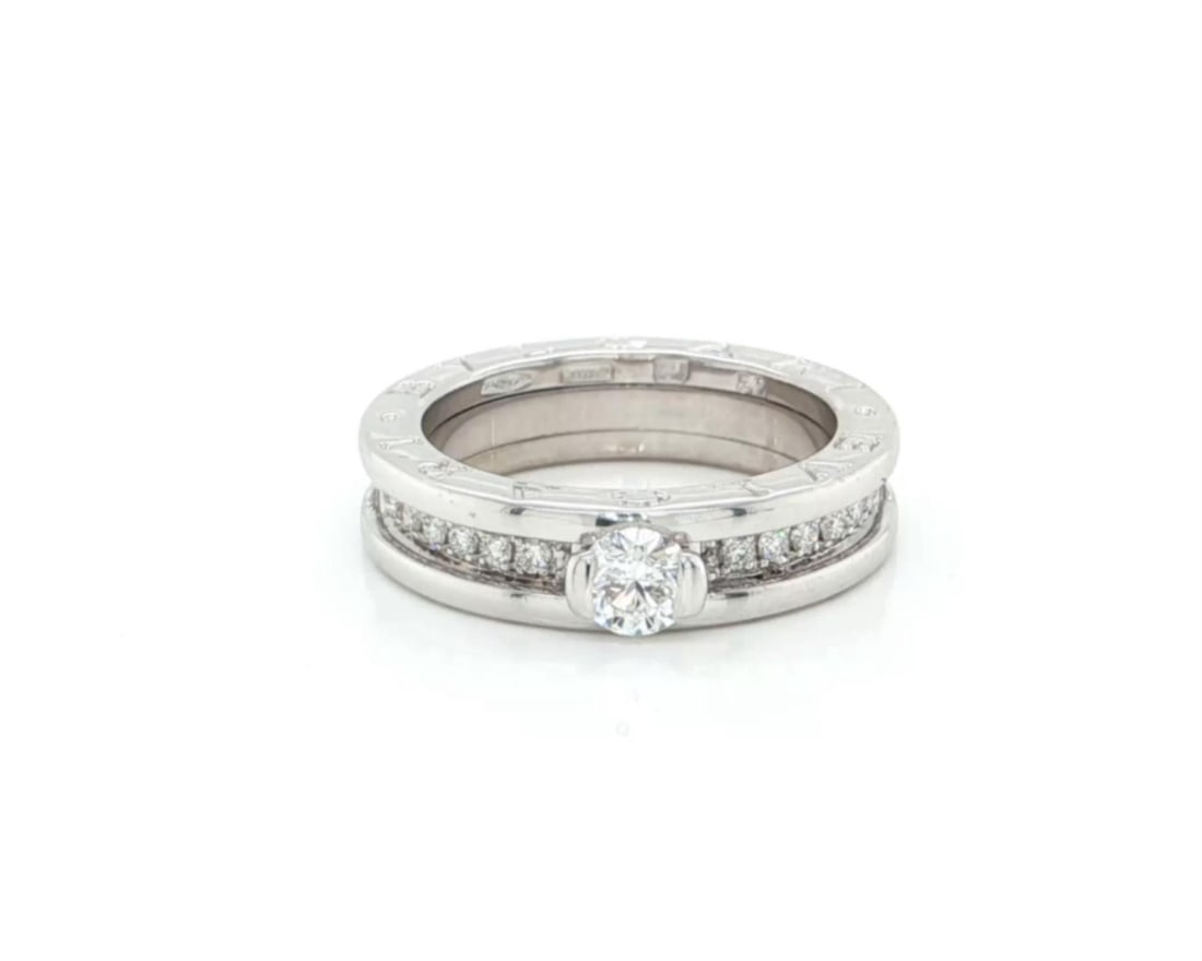 Bvlgari B.zero1 18k White Gold Diamond Ring Size 6 with Box and Certificate: Bvlgari B.zero1 18k White Gold Diamond Ring Size 6 with Box and Certificate This Bvlgari B.zero1 ring is crafted from 18k white gold and features a central solitaire diamond of approximately 0.30 cara