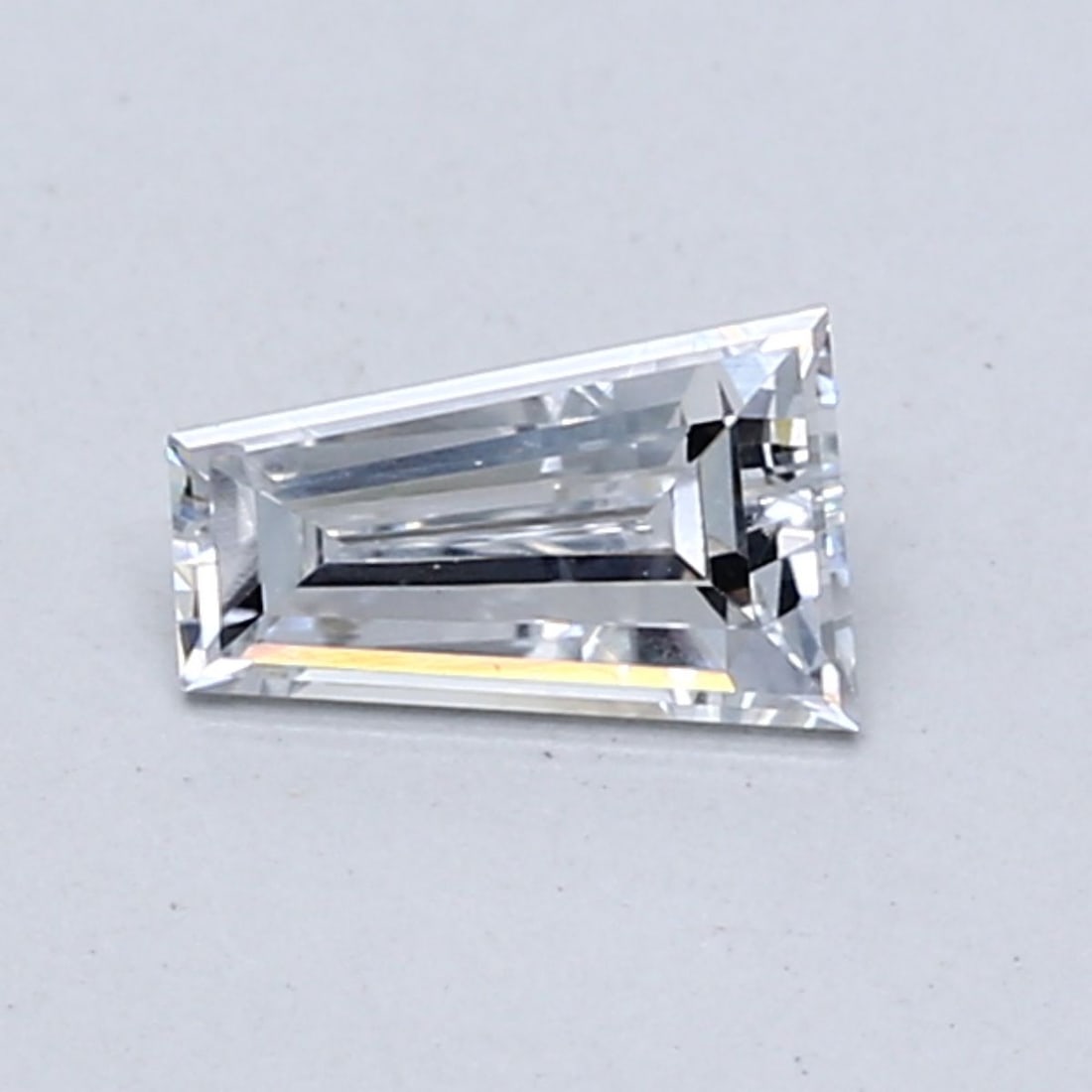 Loose Diamond - TAPERED BAGUETTE 0.44ct Light Blue VS1: Loose Diamond - TAPERED BAGUETTE 0.44ct Light Blue VS1 Source: This is a real non-mined Diamond that has been grown in a lab Shape: TAPERED BAGUETTE Carats: 0.44 Color: Light Blue Certification: NONE 