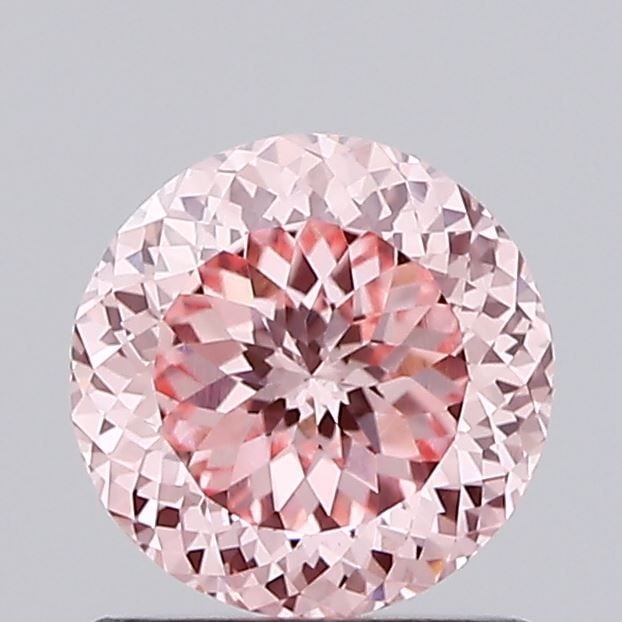 Loose Diamond - ROUND 1.1ct Fancy Vivid Pink VS1: Loose Diamond - ROUND 1.1ct Fancy Vivid Pink VS1 Source: This is a real non-mined Diamond that has been grown in a lab Shape: ROUND Carats: 1.1 Color: Fancy Vivid Pink Certification: IGI Video: