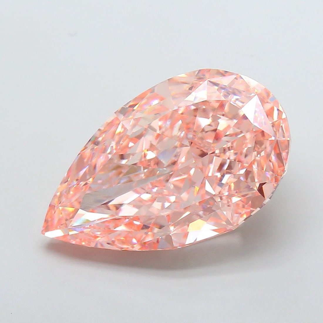 Loose Diamond - PEAR 21.1ct Fancy Vivid Pink VVS2: Loose Diamond - PEAR 21.1ct Fancy Vivid Pink VVS2 Source: This is a real non-mined Diamond that has been grown in a lab Shape: PEAR Carats: 21.1 Color: Fancy Vivid Pink Certification: IGI Video: