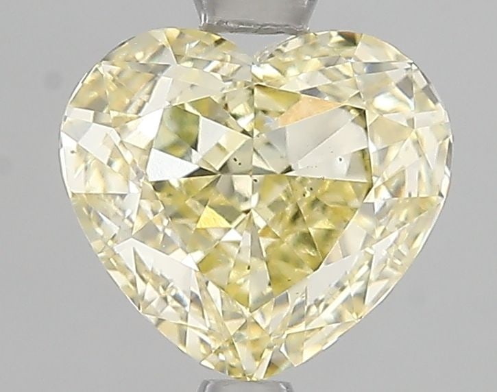 Loose Diamond - HEART 2.01ct Fancy Yellow VS2: Loose Diamond - HEART 2.01ct Fancy Yellow VS2 Source: This is a real non-mined Diamond that has been grown in a lab Shape: HEART Carats: 2.01 Color: Fancy Yellow Certification: IGI Video: