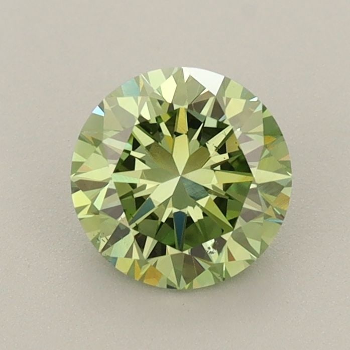 Loose Diamond - ROUND 0.94ct Fancy Vivid Green VS2: Loose Diamond - ROUND 0.94ct Fancy Vivid Green VS2 Source: This is a real non-mined Diamond that has been grown in a lab Shape: ROUND Carats: 0.94 Color: Fancy Vivid Green Certification: IGI Video: