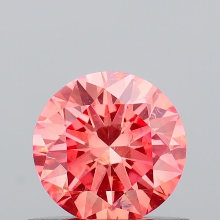 Loose Diamond - ROUND 0.53ct Fancy Vivid Pink VS1: Loose Diamond - ROUND 0.53ct Fancy Vivid Pink VS1 Source: This is a real non-mined Diamond that has been grown in a lab Shape: ROUND Carats: 0.53 Color: Fancy Vivid Pink Certification: IGI Video: