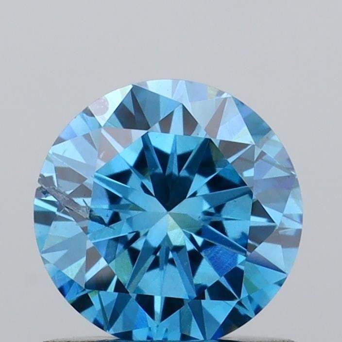 Loose Diamond - ROUND 0.74ct Fancy Vivid Blue SI2: Loose Diamond - ROUND 0.74ct Fancy Vivid Blue SI2 Source: This is a real non-mined Diamond that has been grown in a lab Shape: ROUND Carats: 0.74 Color: Fancy Vivid Blue Certification: IGI Video: