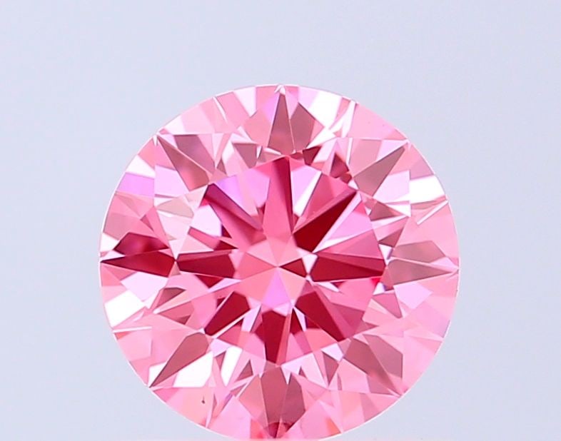 Ideal Loose Diamond - ROUND 1.05ct Fancy Vivid Pink VS1: Ideal Loose Diamond - ROUND 1.05ct Fancy Vivid Pink VS1 Source: This is a real non-mined Diamond that has been grown in a lab Shape: ROUND Carats: 1.05 Color: Fancy Vivid Pink Certification: IGI Video