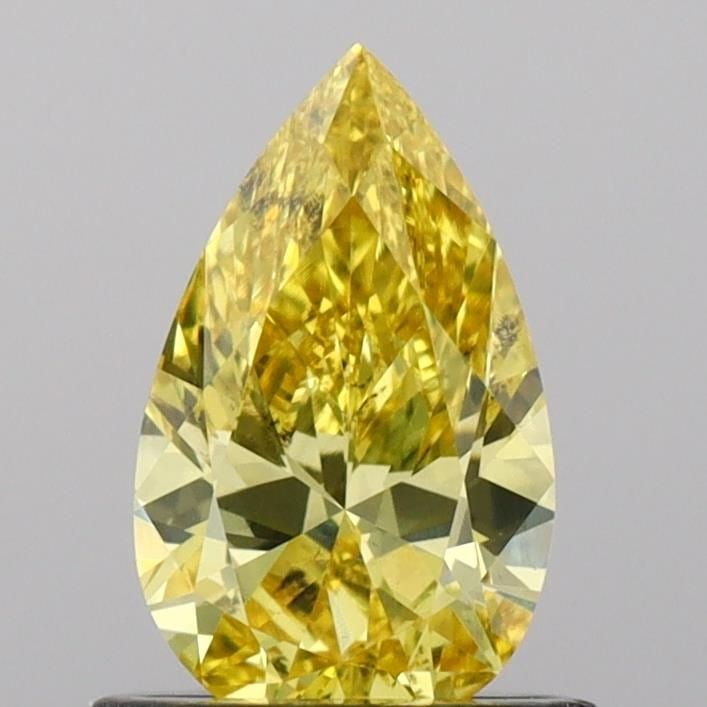 Loose Diamond - PEAR 0.72ct Fancy Vivid Yellow VS2: Loose Diamond - PEAR 0.72ct Fancy Vivid Yellow VS2 Source: This is a real non-mined Diamond that has been grown in a lab Shape: PEAR Carats: 0.72 Color: Fancy Vivid Yellow Certification: IGI Video: