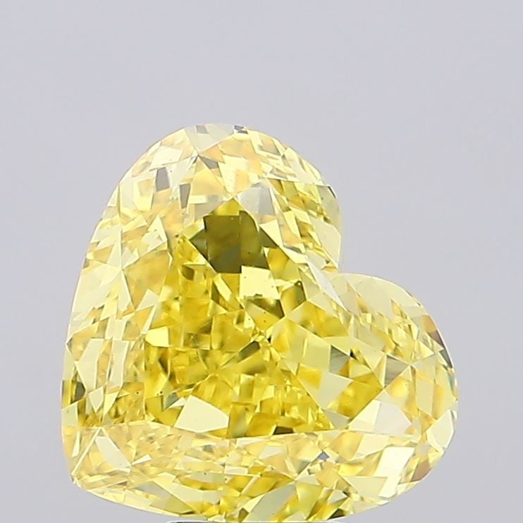 Loose Diamond - HEART 7.04ct Fancy Vivid Yellow VS2: Loose Diamond - HEART 7.04ct Fancy Vivid Yellow VS2 Source: This is a real non-mined Diamond that has been grown in a lab Shape: HEART Carats: 7.04 Color: Fancy Vivid Yellow Certification: IGI Video: