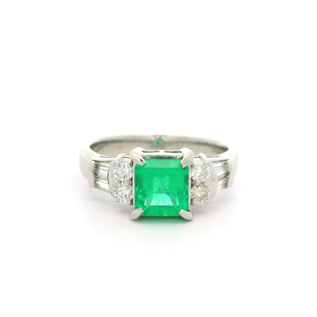 GIA Certified 1.5ctw Colombian Emerald Diamond Ring in Platinum: GIA Certified 1.5ctw Colombian Emerald Diamond Ring in Platinum This exquisite cocktail ring features a stunning 1.03ct natural Colombian emerald, skillfully cut in an octagonal step style and prong s