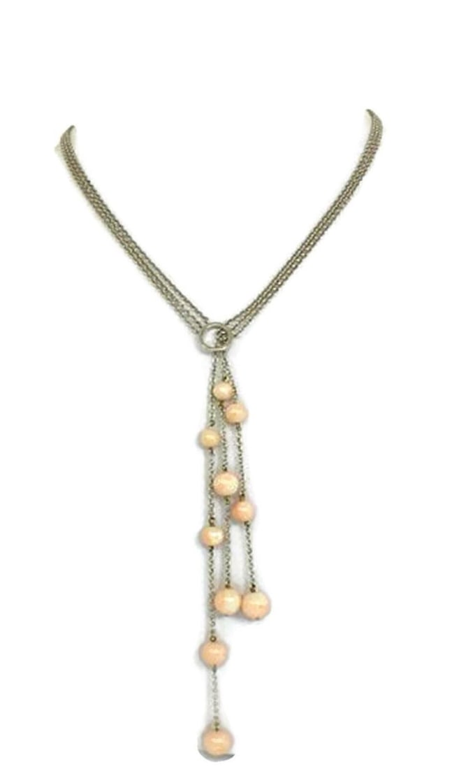 Basilio Liverino 18k White Gold Triple Drop Coral Lariat Necklace: Basilio Liverino 18k White Gold Triple Drop Coral Lariat Necklace This Basilio Liverino necklace is crafted from solid 18k white gold and features a striking triple-drop pendant adorned with graduated
