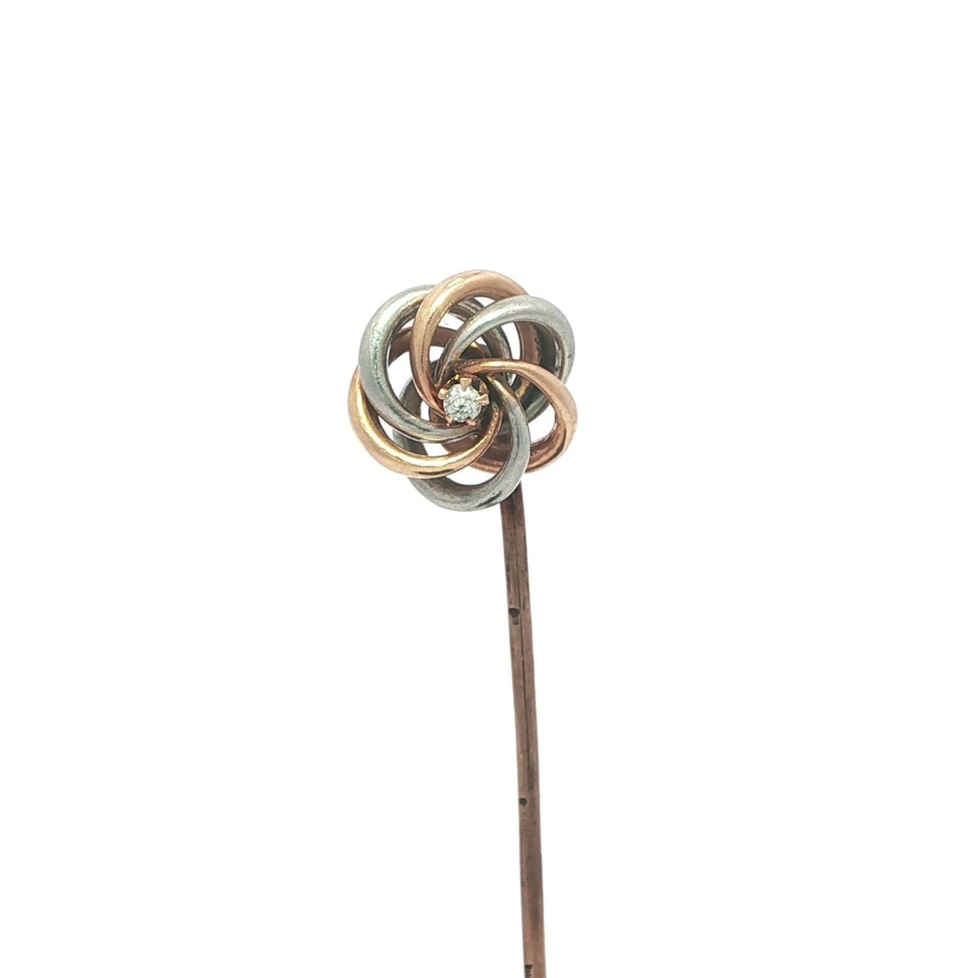 9k Rose Gold and Platinum Antique Diamond Knot Motif Stick Pin: 9k Rose Gold and Platinum Antique Diamond Knot Motif Stick Pin This antique stick pin features an open love knot design crafted from solid 9k rose gold with a platinum top. It is set with a single old