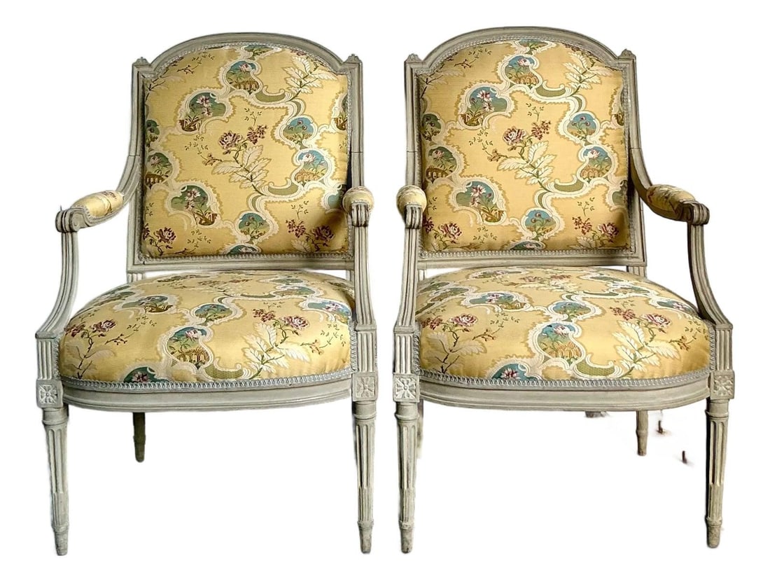 Pair of Louis XVI Style French Armchairs with Yellow Jacquard Upholstery: Pair of Louis XVI Style French Armchairs with Yellow Jacquard Upholstery This exquisite pair of vintage French Regency Louis XVI style fauteuils features open armrests, fluted tapered legs, carved ros