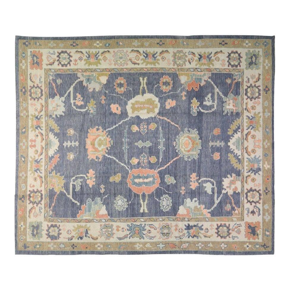 9'3 x 11'2 Wool Oushak Rug Hand Knotted Turkish Design: 9'3 x 11'2 Wool Oushak Rug Hand Knotted Turkish Design This Turkish Oushak rug is hand-knotted from high-quality wool using traditional rug-making techniques. It features a blend of classic artistry a