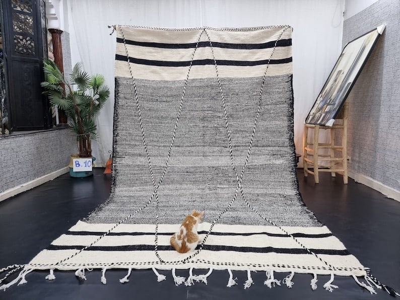 Authentic Handwoven Moroccan Rug 8 x 5 feet 100% Wool: Authentic Handwoven Moroccan Rug 8 x 5 feet 100% Wool Elevate your home decor with this Stylish Authentic Rug, handwoven in the Atlas Mountains by skilled local Berber women weavers. Crafted using tra