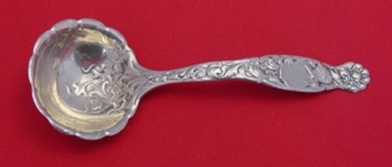 Whiting Heraldic Sterling Silver Gravy Ladle 7.5 Inch Fancy Design: Whiting Heraldic Sterling Silver Gravy Ladle 7.5 Inch Fancy Design This exquisite gravy ladle from the Heraldic pattern by Whiting is crafted from sterling silver, showcasing a scalloped and fancy des