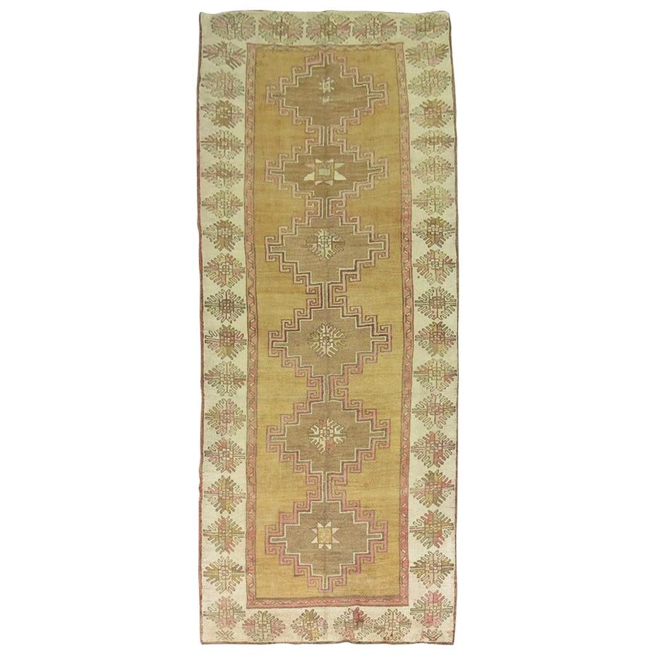Zabihi Vintage Turkish Runner Wool Hand-Knotted Tribal Design 4'6" x 12'7": Zabihi Vintage Turkish Runner Wool Hand-Knotted Tribal Design 4'6" x 12'7" This stunning vintage Turkish runner from the Zabihi Collection showcases a unique geometric design, perfect for adding a tou