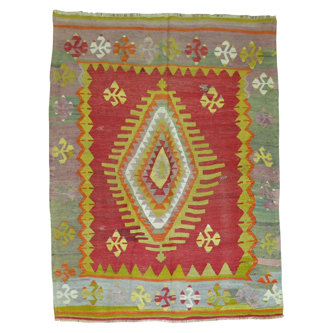 Mid 20th Century Turkish Wool Tribal Kilim Rug: Mid 20th Century Turkish Wool Tribal Kilim Rug This vintage Turkish Kilim rug from the mid-20th century features a vibrant flat-weave design with a traditional central medallion and border. The main f