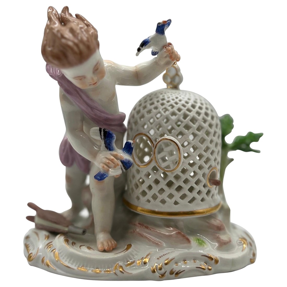 19th Century Meissen Porcelain Boy with Bird Cage Figurine: 19th Century Meissen Porcelain Boy with Bird Cage Figurine This exquisite Antique Meissen Porcelain figurine features a charming depiction of a young boy interacting with his pet bird. The detailed cr