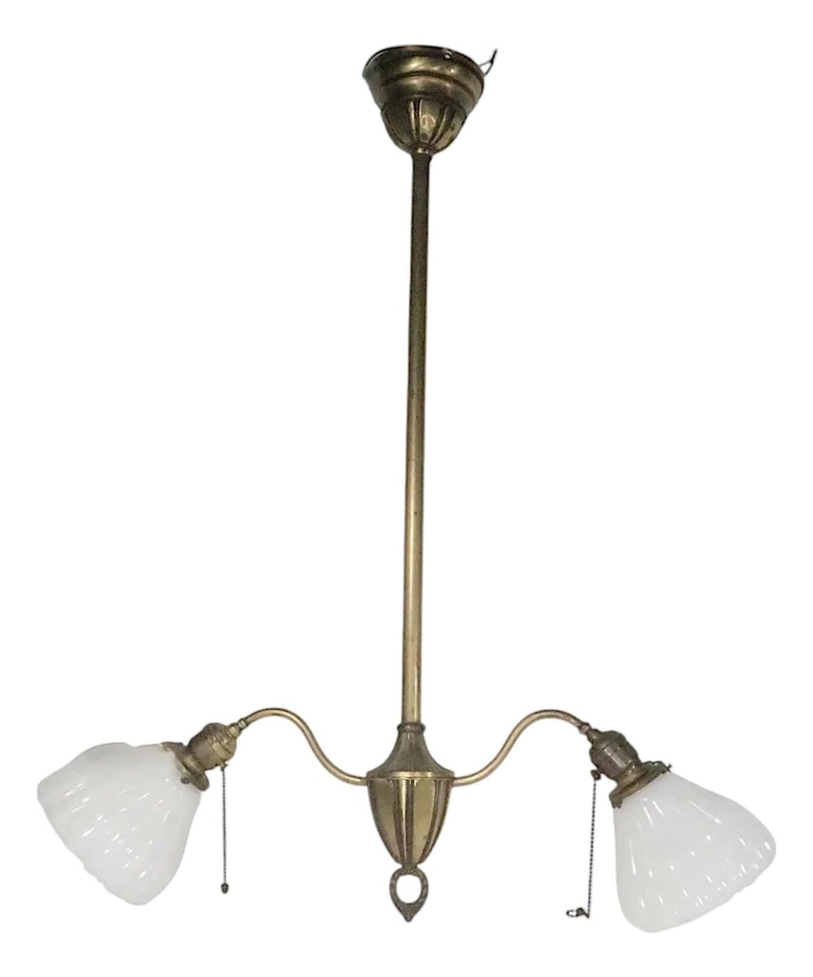 Circa 1900s American Brass Chandelier with Two Arms and Milk Glass Shades: Circa 1900s American Brass Chandelier with Two Arms and Milk Glass Shades This early electric brass two-arm chandelier dates from circa 1900 to the 1920s and features classic period design elements. I