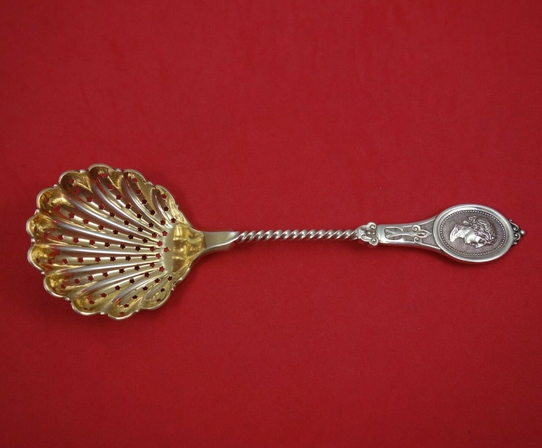 Kidney & Johnson Medallion Sterling Silver Sugar Sifter Gold Wash 8 Inch: Kidney & Johnson Medallion Sterling Silver Sugar Sifter Gold Wash 8 Inch This exquisite sugar sifter from Kidney & Johnson features the elegant Medallion pattern. Crafted from high-quality sterling