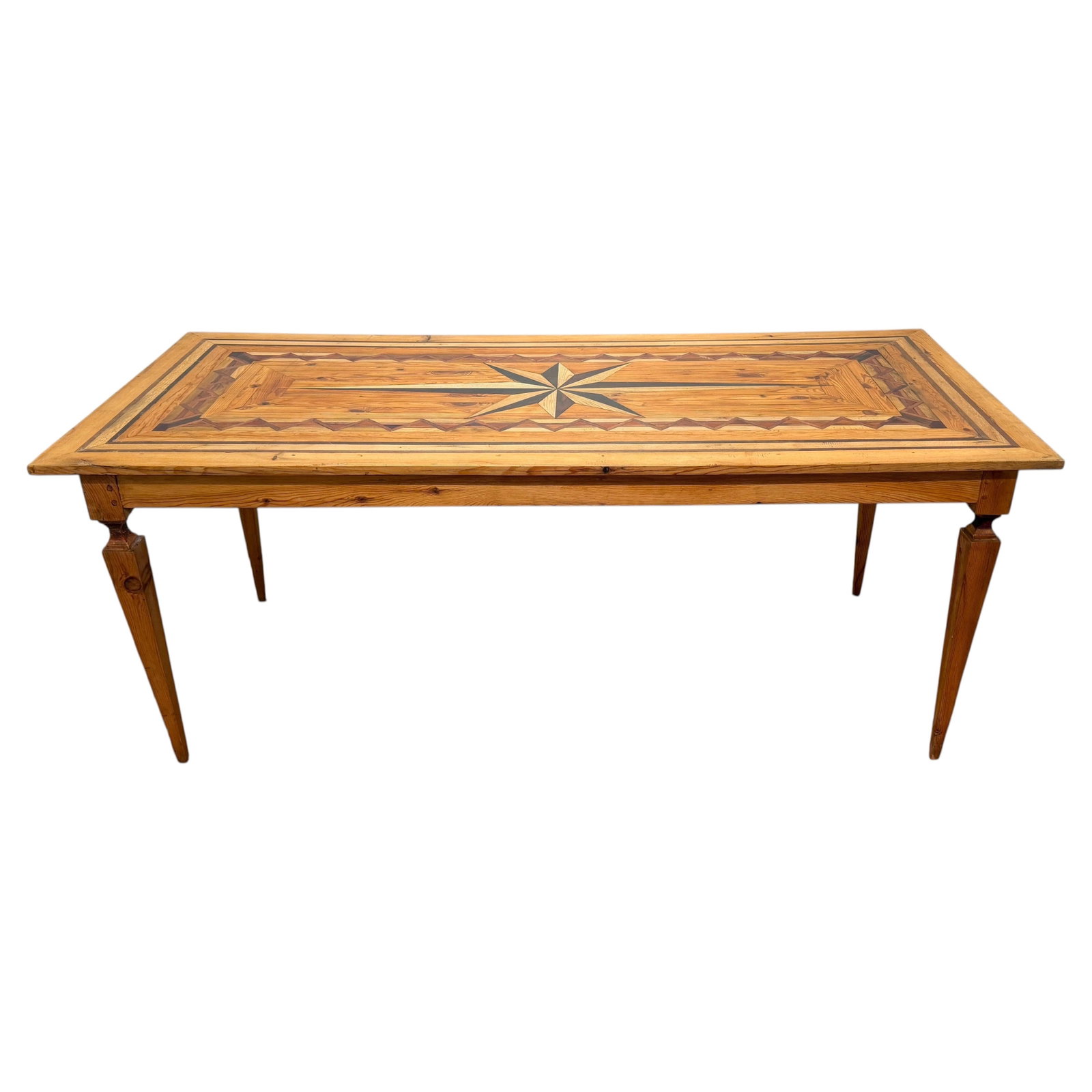 Spanish Colonial Revival Harvest Table Compass Star Inlay: Spanish Colonial Revival Harvest Table Compass Star Inlay This Spanish Colonial Revival marquetry farmhouse dining table features a bold geometric marquetry top with a central eight-point compass star