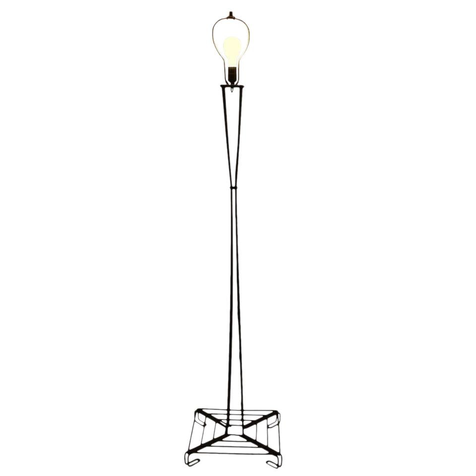 Contemporary Wrought Iron Floor Lamp Black Finish 66.25 in: Contemporary Wrought Iron Floor Lamp Black Finish 66.25 in This striking architectural iron rod floor lamp features a unique waisted form crafted from bent wrought iron rods. The lamp is finished in a