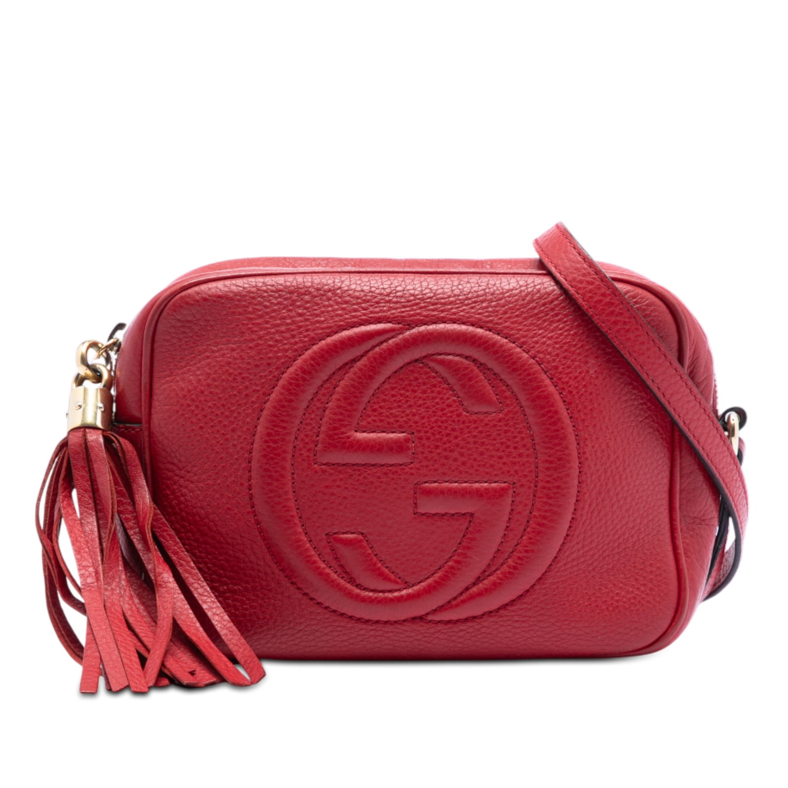 Red Leather Soho Disco Shoulder Bag by Gucci with Tassel Accent: Red Leather Soho Disco Shoulder Bag by Gucci with Tassel Accent This Gucci Soho Disco crossbody features a red leather body with a tassel detail and an adjustable flat leather strap. The bag is design