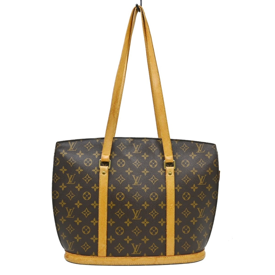 Louis Vuitton Babylone Monogram Canvas Large Tote M51102: Louis Vuitton Babylone Monogram Canvas Large Tote M51102 Vintage Louis Vuitton Babylone tote bag in brown Monogram canvas with leather trim and double handles. This women's handbag features a zip clos