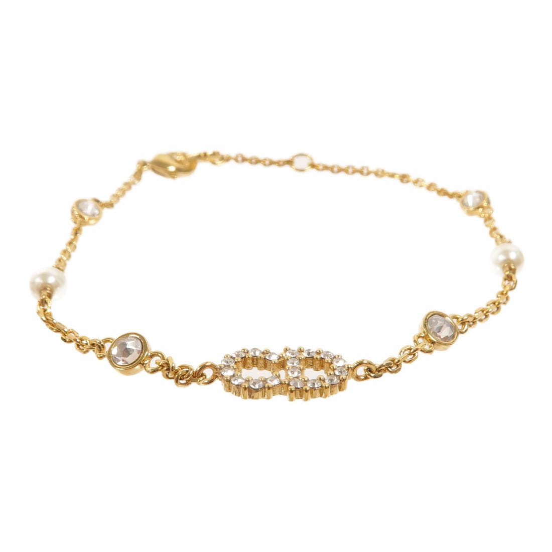 Dior CD Clair D Lune Gold Tone Bracelet: Dior CD Clair D Lune Gold Tone Bracelet Christian Dior CD Clair D Lune bracelet in gold-tone metal. This women's bracelet is made in France and features a no-stone design. Condition is rated AB: Very 