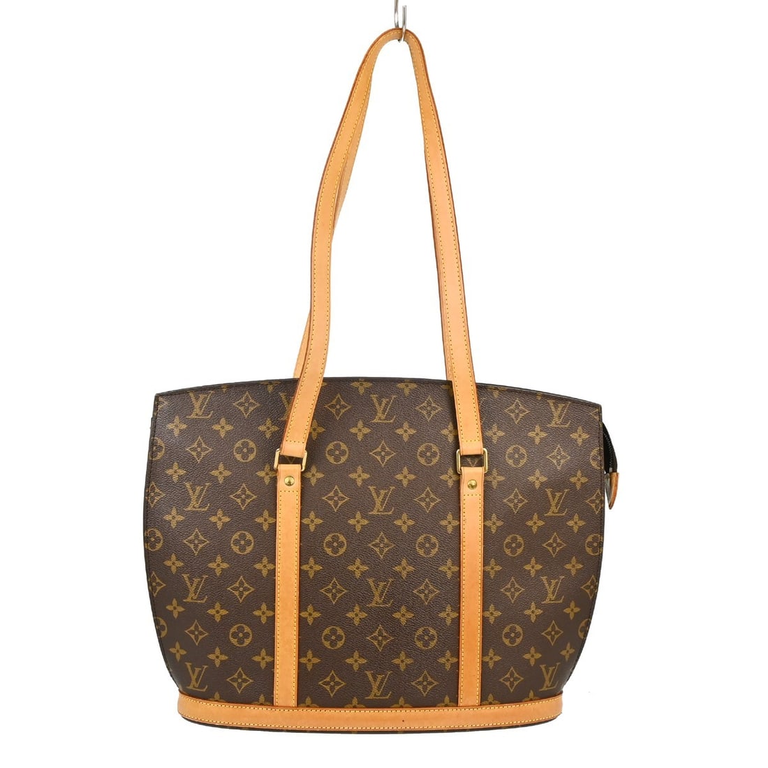 Louis Vuitton Babylone Monogram Canvas Tote Bag M51102: Louis Vuitton Babylone Monogram Canvas Tote Bag M51102 Vintage Louis Vuitton Babylone tote bag in brown Monogram canvas with leather trim and double handles. This zip-top handbag features a brown inte