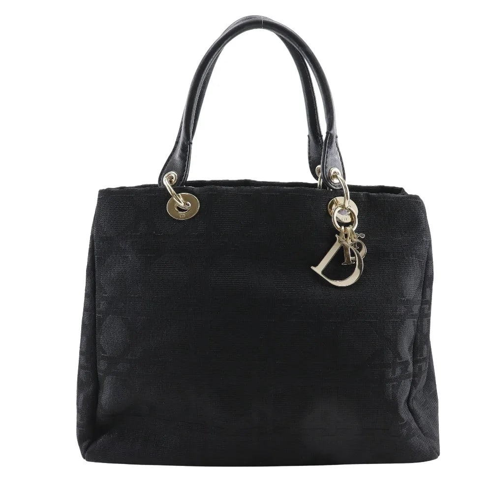 Black Canvas Lady Cannage Tote by Christian Dior for Women: Black Canvas Lady Cannage Tote by Christian Dior for Women This Christian Dior Lady Cannage Matelasse bag is crafted from black canvas and designed for women. It features a spacious interior, with min