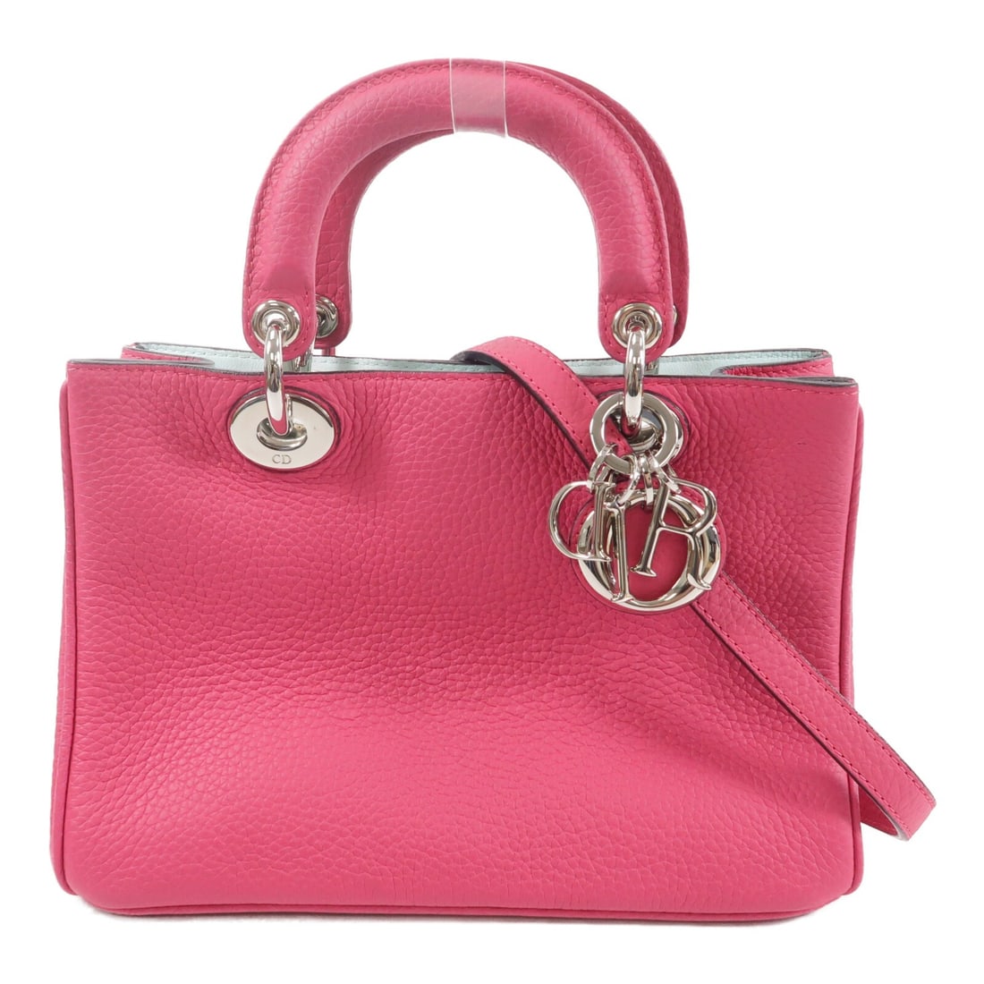 Dior Diorissimo pink calfskin 2 way shoulder bag: Dior Diorissimo pink calfskin 2 way shoulder bag Christian Dior Diorissimo 2-way shoulder bag in pink calfskin leather. Designed for women, this bag shows reasonable wear and tear consistent with cond