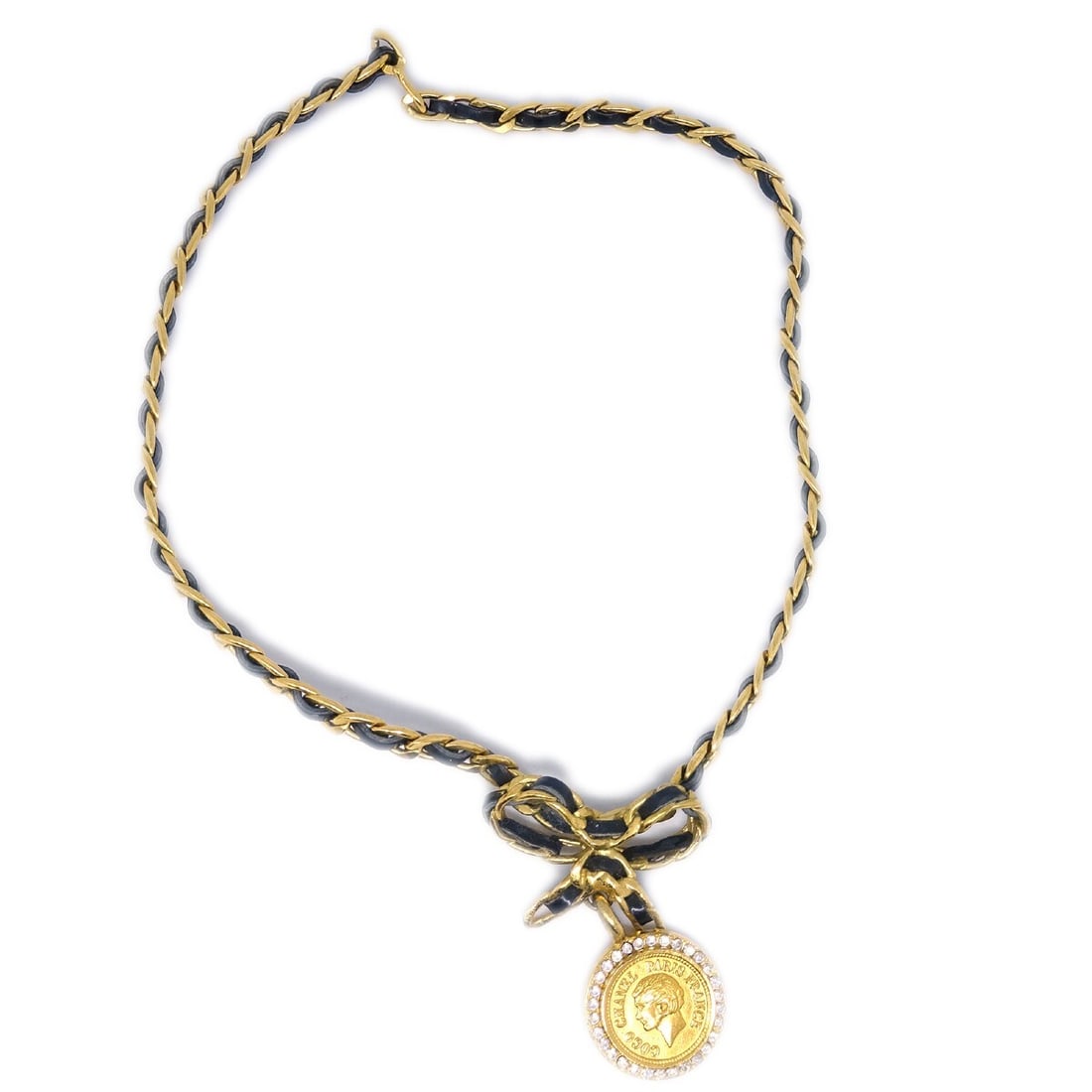 Chanel 96P Bow Charm Necklace Gold Plated Black Rhinestone: Chanel 96P Bow Charm Necklace Gold Plated Black Rhinestone Chanel 96P pendant necklace featuring a gold and black bow medallion design with rhinestone accents. Crafted in France, this chain necklace i