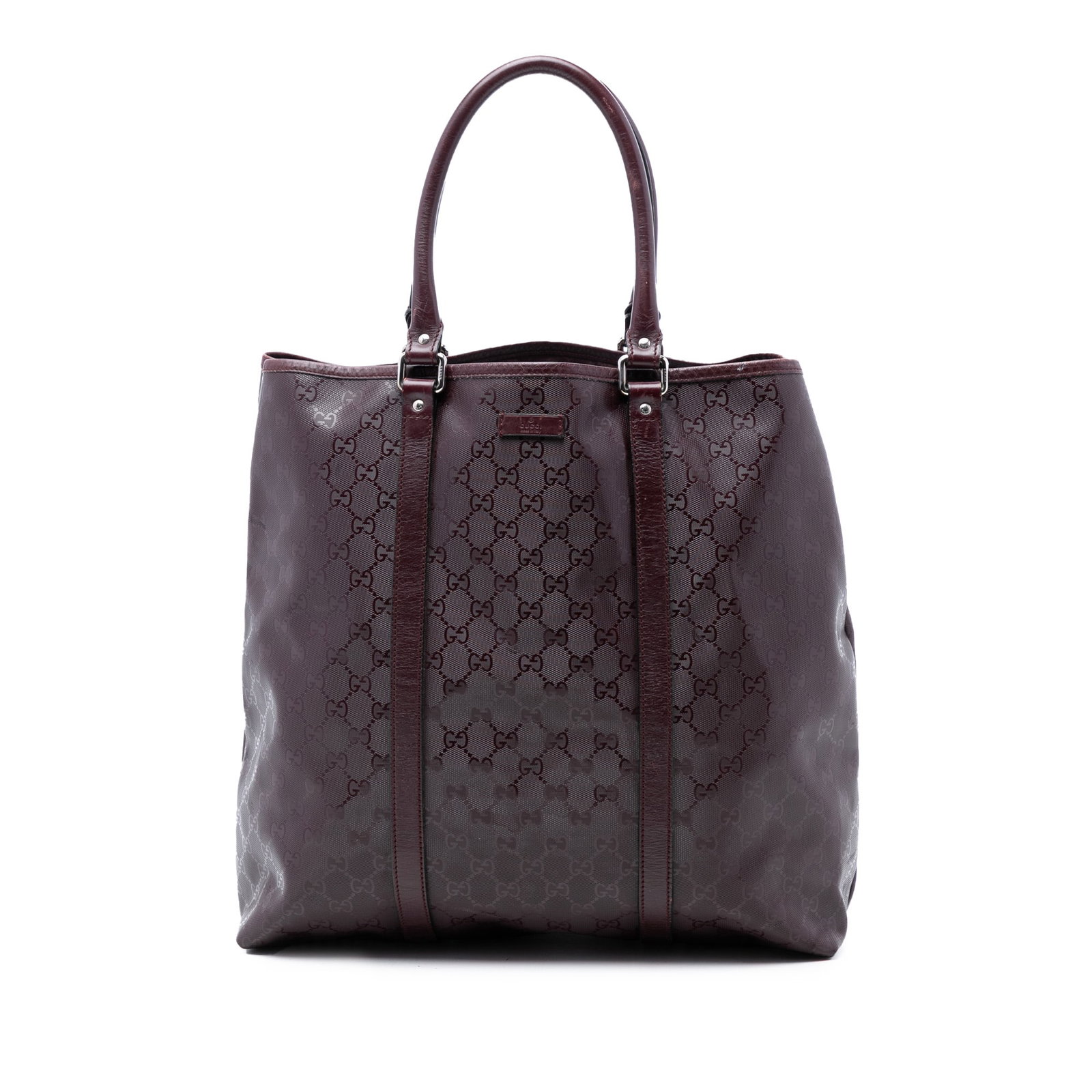Red GG Imprime Joy Vertical Tote Bag by Gucci with Leather Trim: Red GG Imprime Joy Vertical Tote Bag by Gucci with Leather Trim This Gucci GG Imprime Joy Vertical Tote features a coated canvas exterior with leather trim and rolled leather handles. The bag has an o